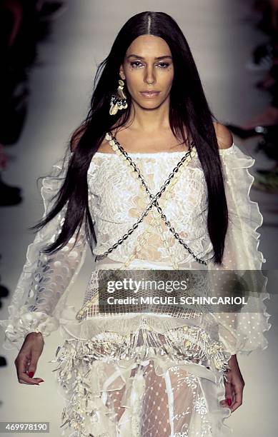 Model Lea T presents a creation Teca by Helo Rocha during the 2016 Summer collections of the Sao Paulo Fashion Week in Sao Paulo, Brazil, on April...