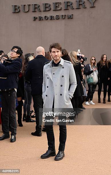 Robert Konjic arrives at Burberry Womenswear Autumn/Winter 2014 at Kensington Gardens on February 17, 2014 in London, England.