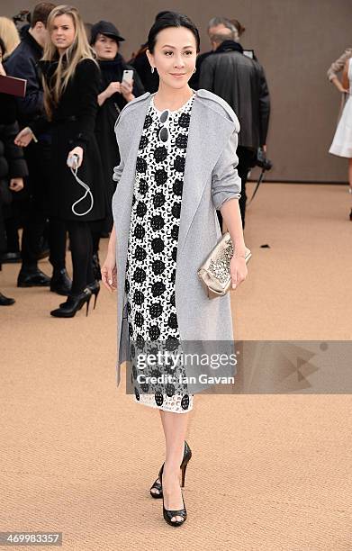 Carina Lau arrives at Burberry Womenswear Autumn/Winter 2014 at Kensington Gardens on February 17, 2014 in London, England.