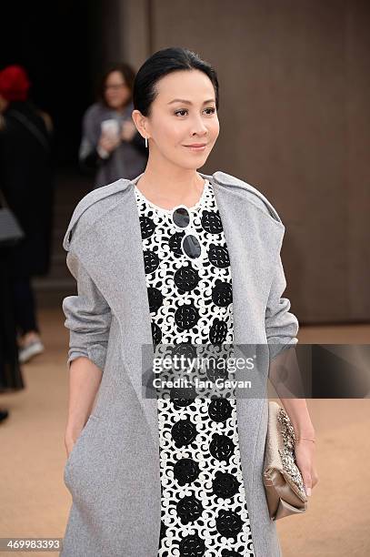 Carina Lau arrives at Burberry Womenswear Autumn/Winter 2014 at Kensington Gardens on February 17, 2014 in London, England.