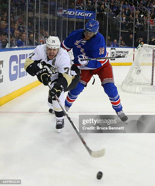 Evgeni Malkin of the Pittsburgh Penguins is checked by Marc Staal of the New York Rangers during the first period in Game One of the Eastern...