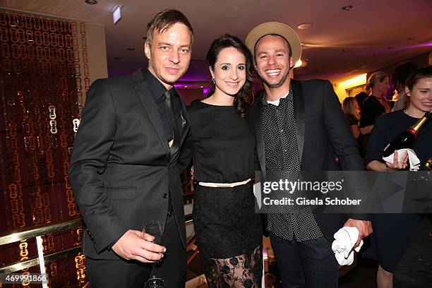 Tom Wlaschiha, Stephanie Stumph and Singer Marlon Roudette during the 50th Anniversary of AIGNER on April 16, 2015 in Munich, Germany.