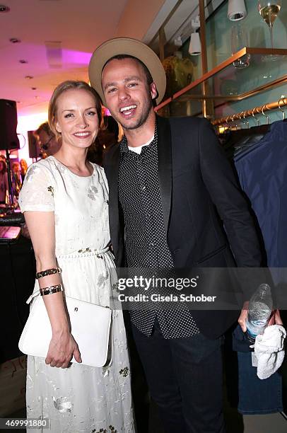 Janin Reinhardt and Marlon Roudette during the 50th Anniversary of AIGNER on April 16, 2015 in Munich, Germany.