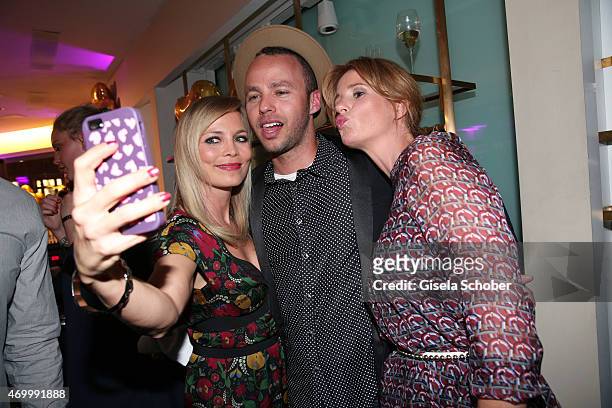 Regina Halmich, Marlon Roudette, Mareile Hoeppner during the 50th Anniversary of AIGNER on April 16, 2015 in Munich, Germany.