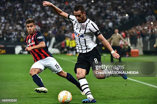 Renato Augusto of Brazils Corinthians, dribbles past by Hector Villalba of Argentina's San Lorenzo, during their 2015 Copa Libertadores football...