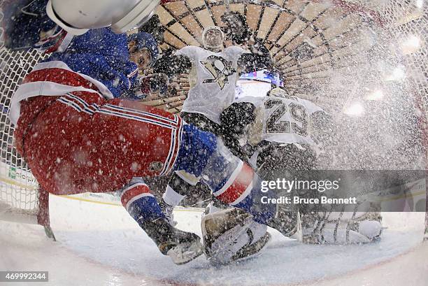 Kevin Hayes of the New York Rangers is checked into the net during the first period against the Pittsburgh Penguins in Game One of the Eastern...