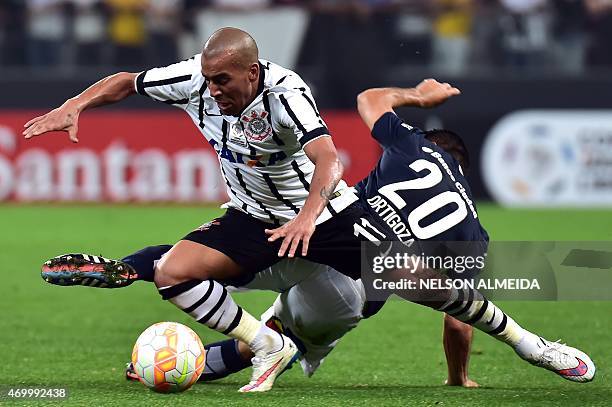 Emerson of Brazils Corinthians, vies for the ball with Nestor Ortigoza of Argentina's San Lorenzo, during their 2015 Copa Libertadores football match...