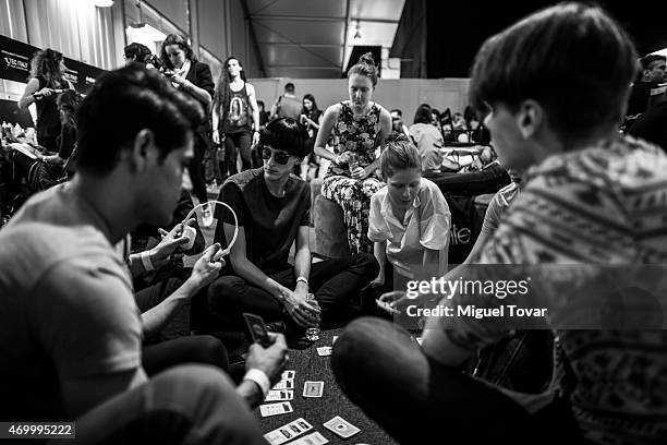 Models rest at the backstage of Mercedes-Benz Fashion Week Mexico Fall/Winter 2015 at Campo Marte on April 16, 2015 in Mexico City, Mexico.