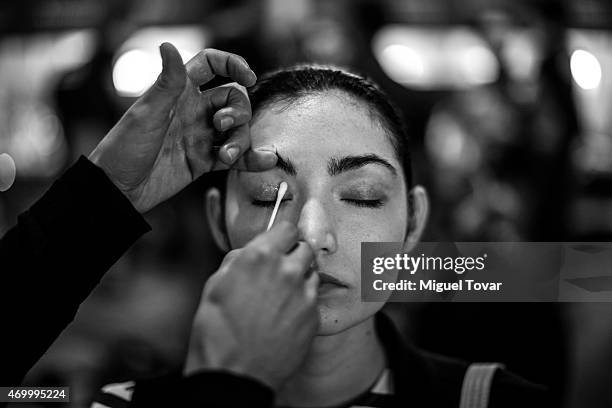 Model gets ready at the backstage of Mercedes-Benz Fashion Week Mexico Fall/Winter 2015 at Campo Marte on April 16, 2015 in Mexico City, Mexico.