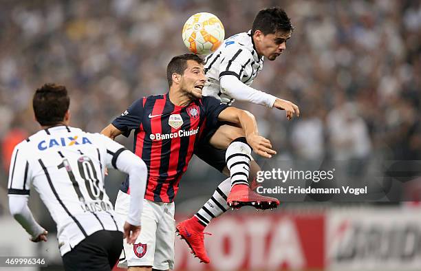 Fagner of Corinthians fights for the ball with Sebastian Blanco of San Lorenzo during a match between Corinthians and San Lorenzo as part of Group 2...