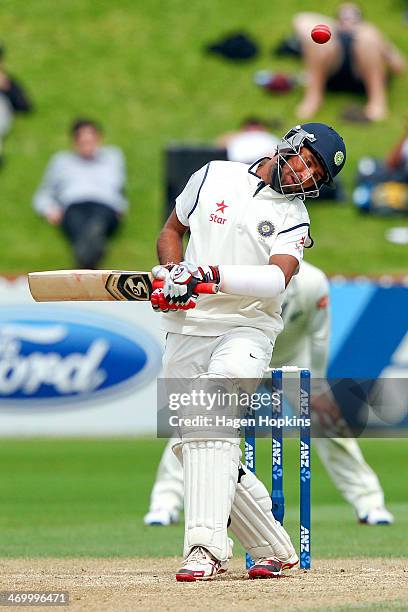 Cheteshwar Pujara of India avoids a bouncer being dismissed during day five of the 2nd Test match between New Zealand and India on February 18, 2014...