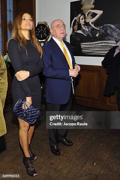 Adriano Galliani and his wife Helga Costa attend 'The Faces' Opening Exhibition on February 17, 2014 in Milan, Italy.