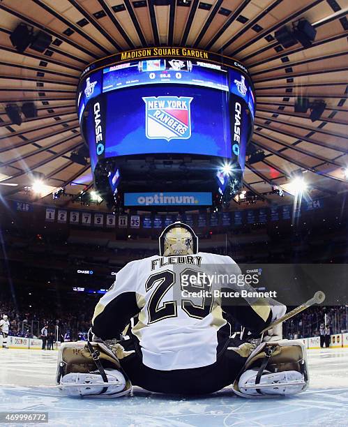 Marc-Andre Fleury of the Pittsburgh Penguins takes a break during the game against the New York Rangers in Game One of the Eastern Conference...