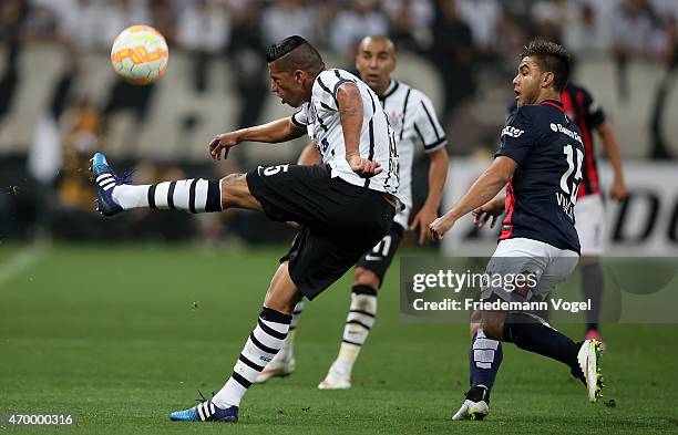 Ralf of Corinthians fights for the ball with Hector Villalba of San Lorenzo during a match between Corinthians and San Lorenzo as part of Group 2 of...