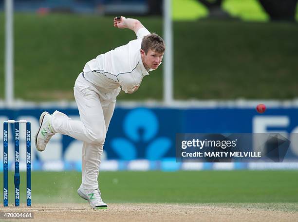 Jimmy Neesham of New Zealand bowls during day 5 of the 2nd International Test cricket match between New Zealand and India in Wellington at the Basin...