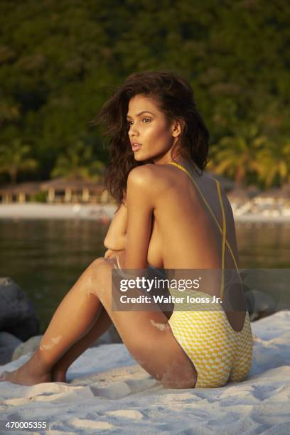 Swimsuit Issue 2014: Model Cris Urena poses for the 2014 Sports Illustrated Swimsuit issue on December 7 on Saint Lucia. Body painting by Joanne...