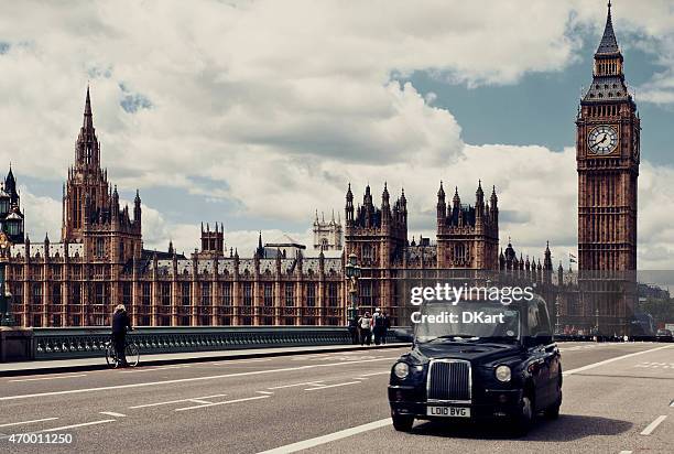 westminster bridge. london - london taxi stock pictures, royalty-free photos & images