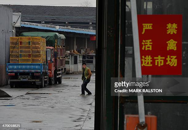 This photo taken on on February 17, 2014 shows a warning sign at a poultry market that has been closed due to the risk of spreading the H7N9 bird flu...