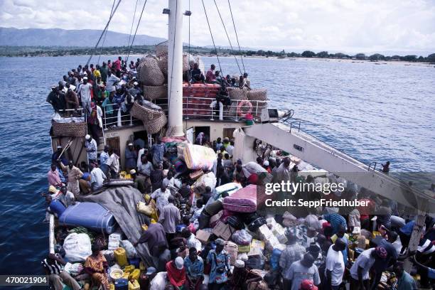 crowded ship liemba on lake tanganjika - african refugee stock pictures, royalty-free photos & images