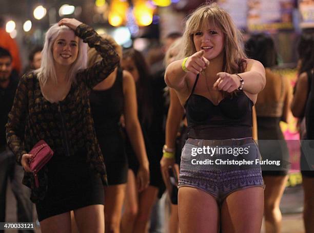 Revellers walk and gather between the various pubs and clubs in Broad Street, the heartland of nightclubs and bars in Birmingham City centre on...