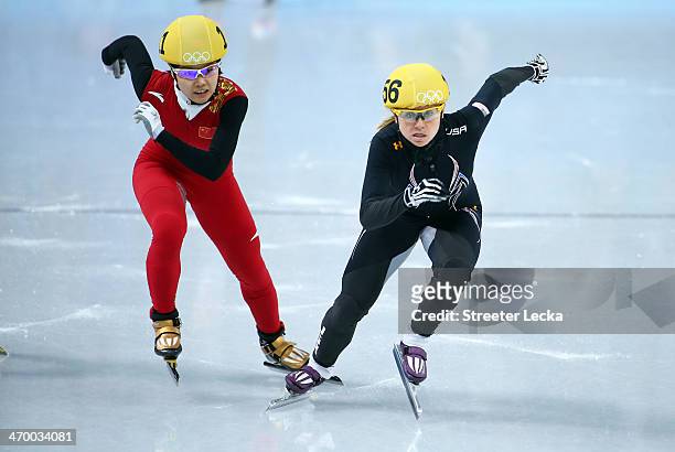Jianrou Li of China and Jessica Smith of the United States compete in the Short Track Ladies' 1000m Heat at Iceberg Skating Palace on day 11 of the...