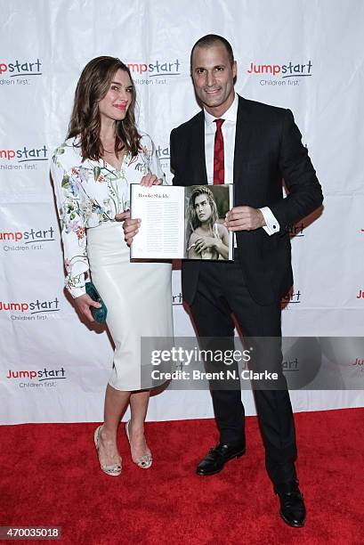Actress Brooke Shields and photographer Nigel Barker pose with Mr. Barker's newest book durng the Scribbles To Novels 10th Anniversary Gala held at...
