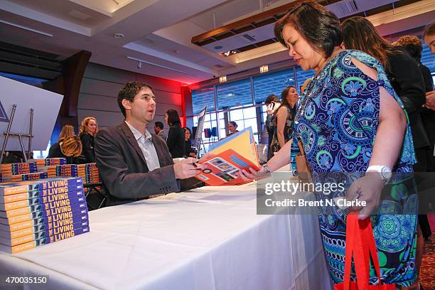 Author Matt De La Pena participates in a book signing during the Scribbles To Novels 10th Anniversary Gala held at Pier Sixty at Chelsea Piers on...