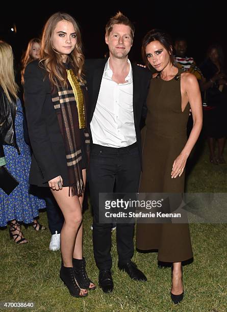 Model Cara Delevingne, chief executive & chief creative officer of Burberry Christopher Bailey and Victoria Beckham attend the Burberry "London in...