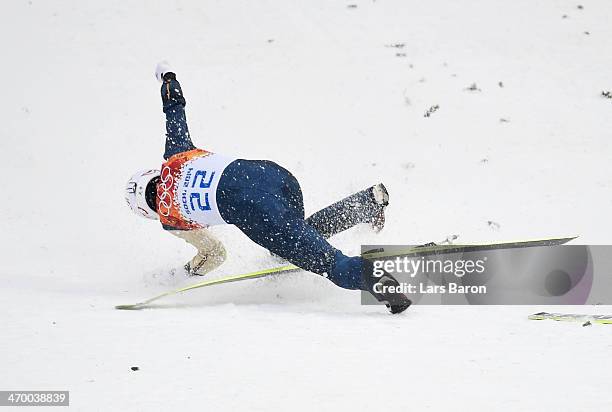 Taihei Kato of Japan crashes as he competes in the Nordic Combined Men's Individual LH during day 11 of the Sochi 2014 Winter Olympics at RusSki...