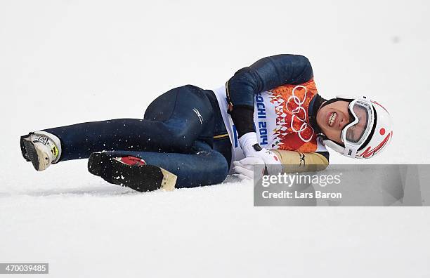 Taihei Kato of Japan crashes as he competes in the Nordic Combined Men's Individual LH during day 11 of the Sochi 2014 Winter Olympics at RusSki...