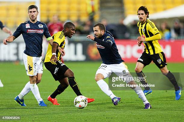 Glen Trifiro of the Mariners beats the defence of Roly Bonevacia of the Phoenix during the round 26 A-League match between the Wellington Phoenix and...