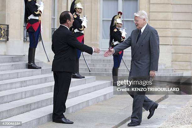 French President Francois Hollande welcomes Iceland President Olafur Ragnar Grimsson before a meeting at the Elysee Palace in Paris on April 17,...