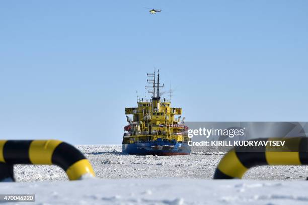 Picture taken on April 16, 2015 shows the icebreaker Tor at the port of Sabetta in the Kara Sea shore line on the Yamal Peninsula in the Arctic...