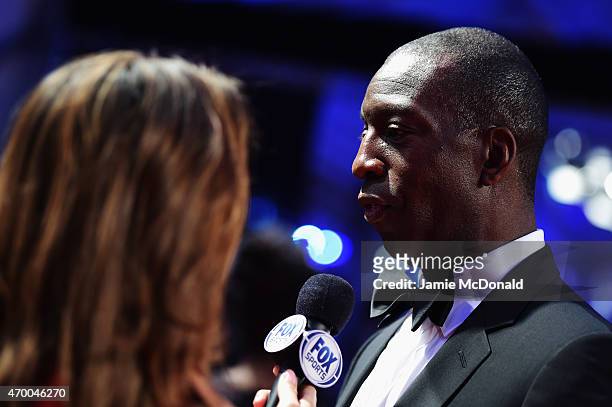 Laureus World Sports Academy member Michael Johnson speaks to the media at the 2015 Laureus World Sports Awards at Shanghai Grand Theatre on April...