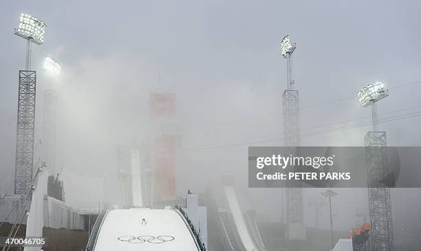 Estonia's Kristjan Ilves competes during the Nordic Combined Individual LH / 10 km Ski Jumping competition at the RusSki Gorki Jumping Center during...