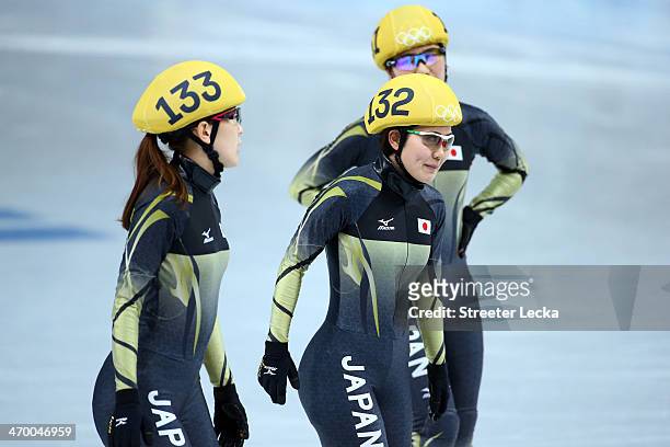 Sayuri Shimizu, Biba Sakurai and Yui Sakai of Japan react after competing in the Short Track Ladies' 3000m Relay Final B at Iceberg Skating Palace on...