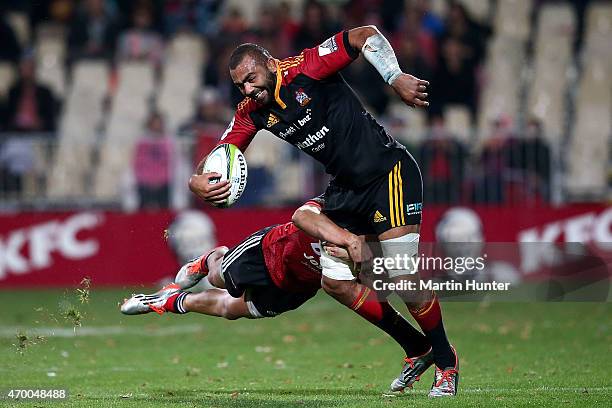 Michael Leitch of the Chiefs is tackled by David Havili of the Crusaders during the round 10 Super Rugby match between the Crusaders and the Chiefs...