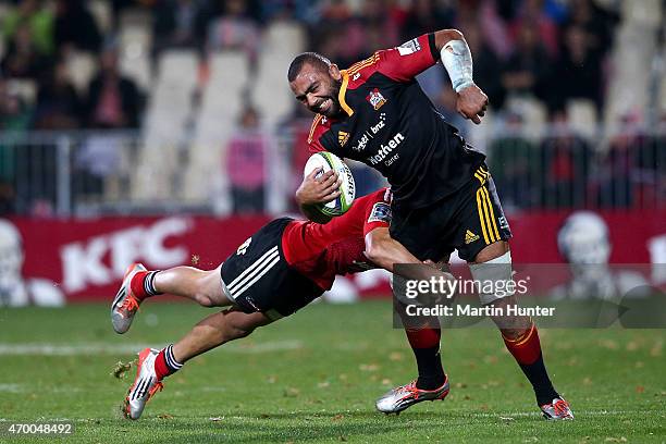 Michael Leitch of the Chiefs is tackled by David Havili of the Crusaders during the round 10 Super Rugby match between the Crusaders and the Chiefs...
