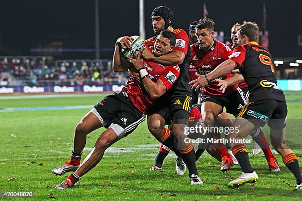 David Havili of the Crusaders is tackled by Liam Messam of the Chiefs during the round 10 Super Rugby match between the Crusaders and the Chiefs at...