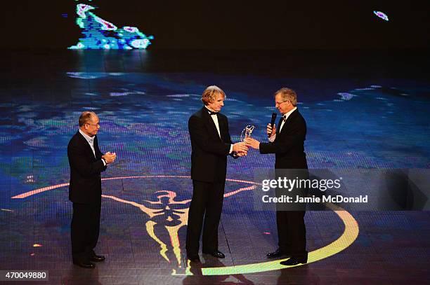 Former Chinese Olympic gymnast Li Ning and Laureus World Sports Academy member Robby Naish present the Laureus Action Sportsperson of the Year Award...