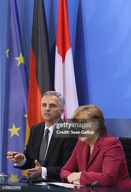 German Chancellor Angela Merkel and Swiss President Didier Burkhalter speak to the media after talks at the Chancellery on February 18, 2014 in...