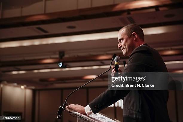 Photographer Nigel Barker conducts a live auction from the stage during the Scribbles To Novels 10th Anniversary Gala held at Pier Sixty at Chelsea...