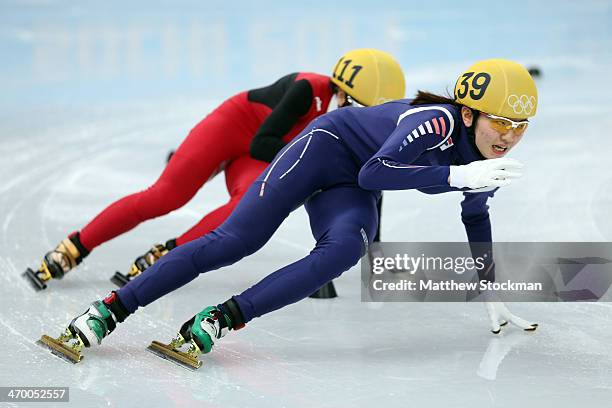 Suk Hee Shim of South Korea leads to Jianrou Li of China in the Short Track Ladies' 3000m Relay Final A at Iceberg Skating Palace on day 11 of the...