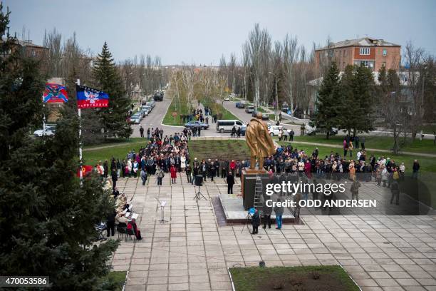 General view of the town square where people attend the unveiling of a Lenin statue in the town of Novoazovsk on April 17, 2015 in the...