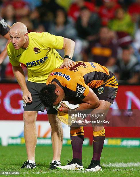 Alex Glenn of the Broncos leaves the field with a fractured eye socket during the round seven NRL match between the St George Illawarra Dragons and...