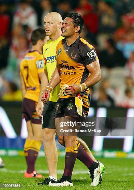 Alex Glenn of the Broncos leaves the field with a fractured eye socket during the round seven NRL match between the St George Illawarra Dragons and...