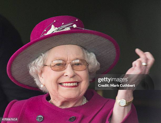 Queen Elizabeth II watches her horse "Ring of Truth" in Race 2 at the Dubai Duty Free Spring Trials Meeting at Newbury Racecourse on April 17, 2015...