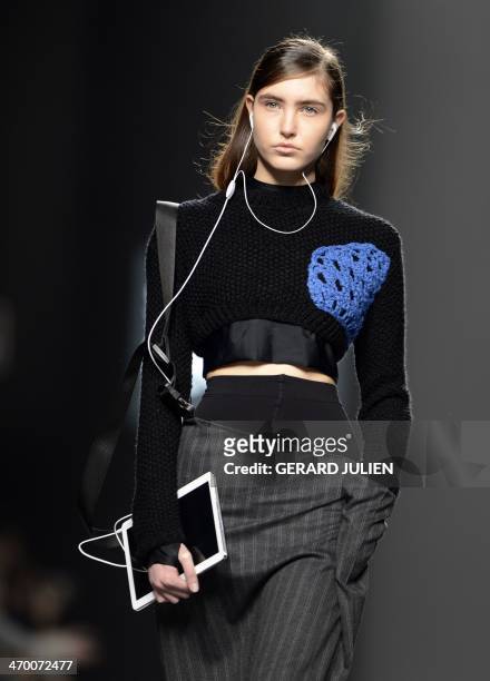 Model presents Autumn/Winter 2014-2015 collection creations by Herida de gato on the last day of Madrid Fashion Week in Madrid on February 18, 2014....