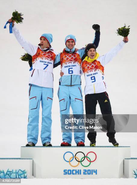 Silver medalist Magnus Hovdal Moan of Norway, gold medalist Joergen Graabak of Norway and bronze medalist Fabian Riessle of Germany celebrate on the...