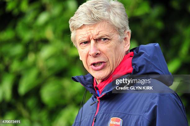 Arsenal's French manager Arsene Wenger attends a training session at Arsenal's training ground at London Colney, north of London on February 18 one...